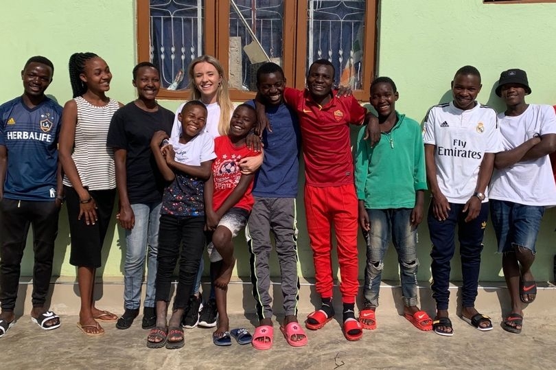A 26-year-old woman has adopted 14 African children